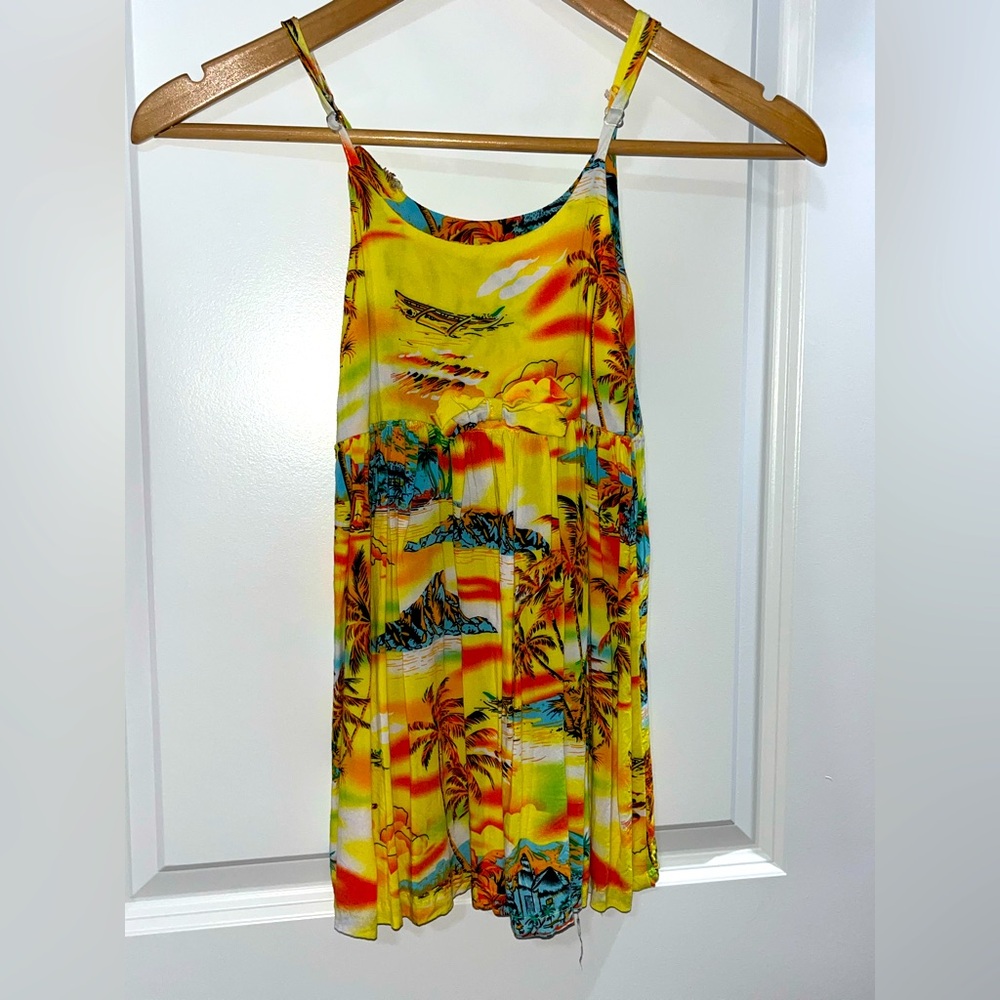 Children’s size 5 Hawaiian dress.Has a little torn spot at the top as shown